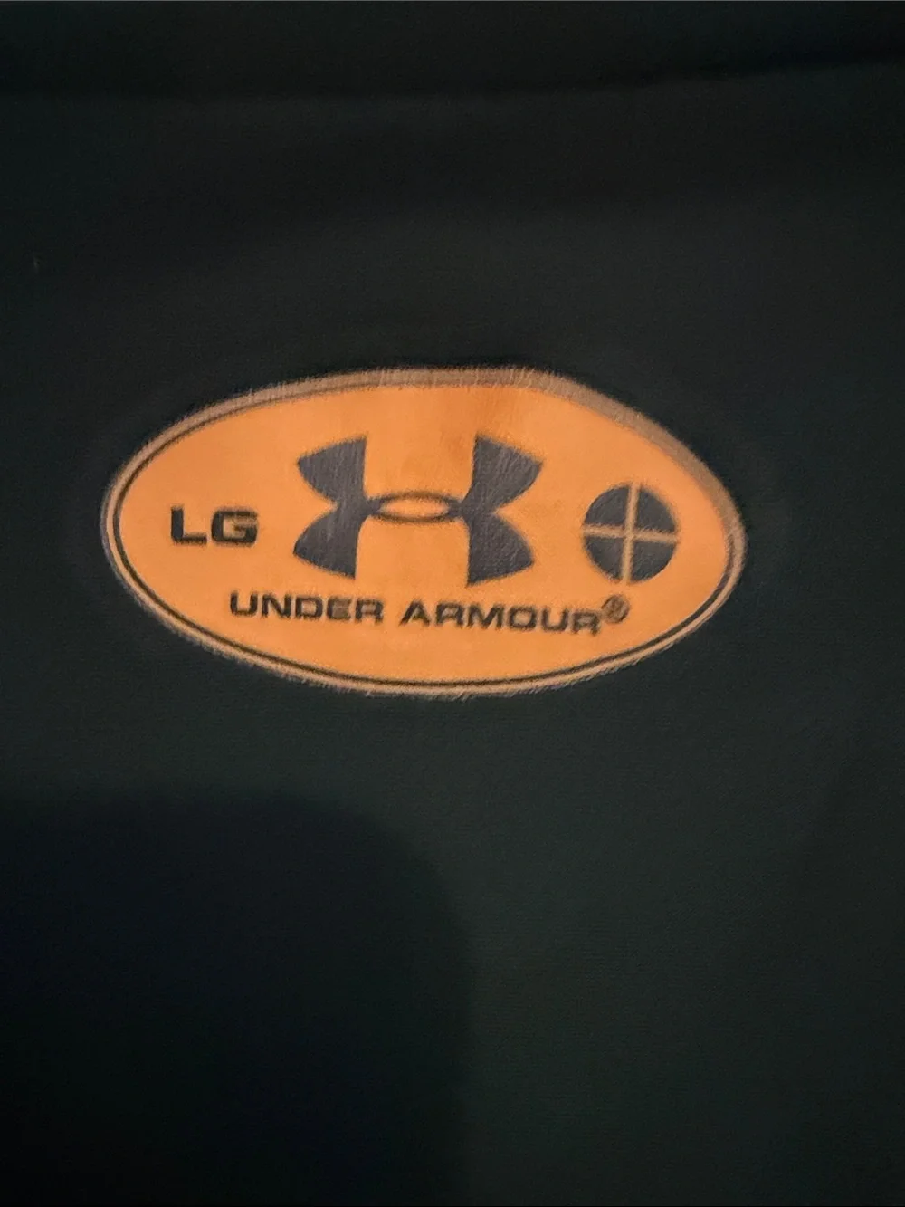 Under Armour boy’s  Forest Green Short Sleeve Performance Tee with Yellow Logo